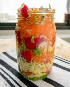 Haiti Pikliz with cabbage, carrot, pepper, clove, peas, in a mason jar